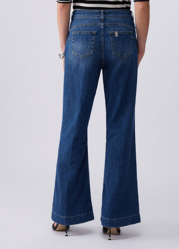 Jeans flare a vita alta con bottoni