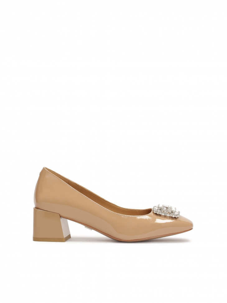 Beige pumps with jewelry embellishment