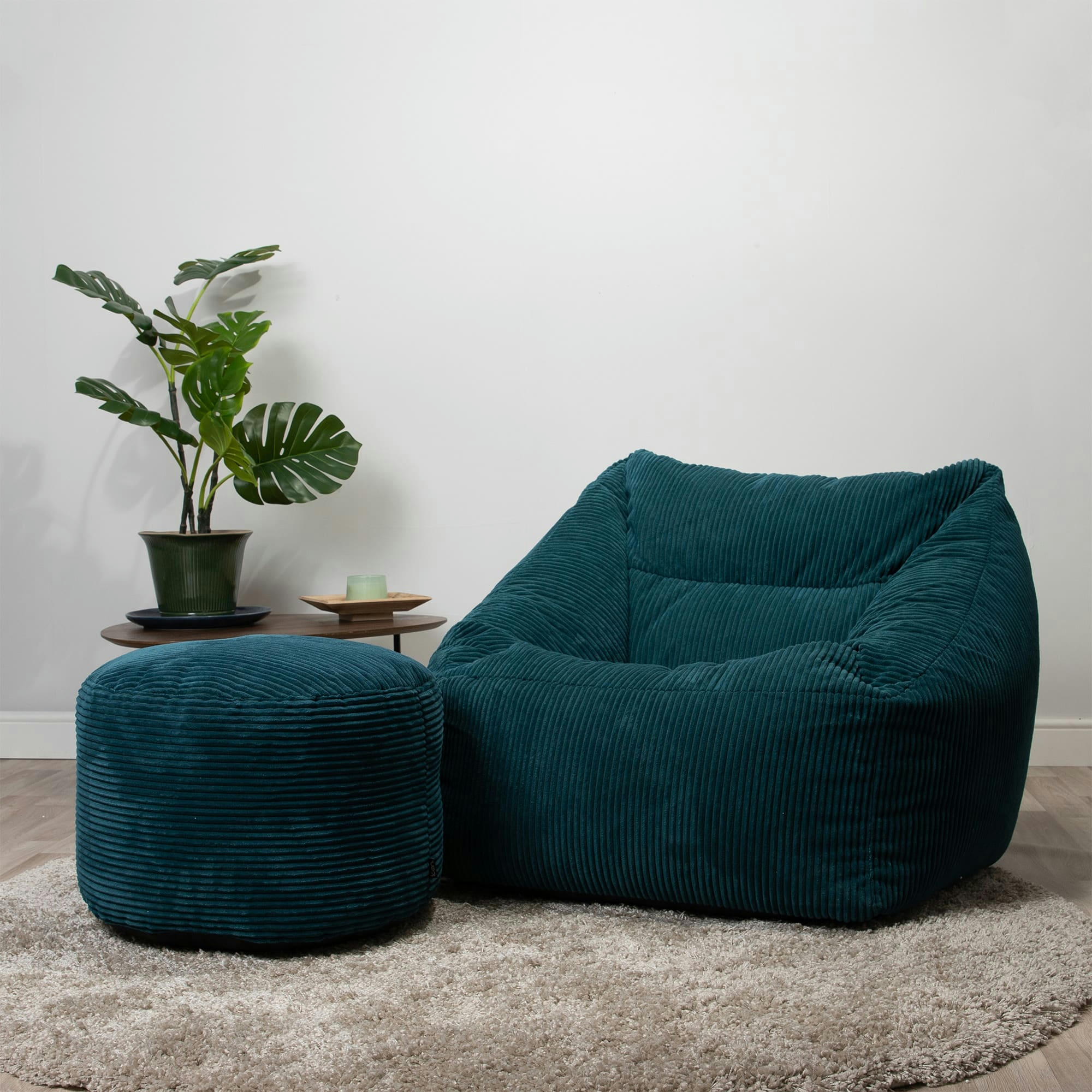 MORGAN - Pouf fauteuil avec repose-pied rond velours côtelé bleu canard