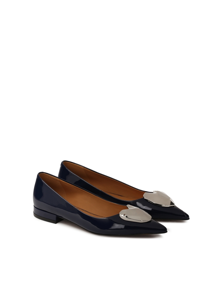 Navy blue flat pumps with large embellishment