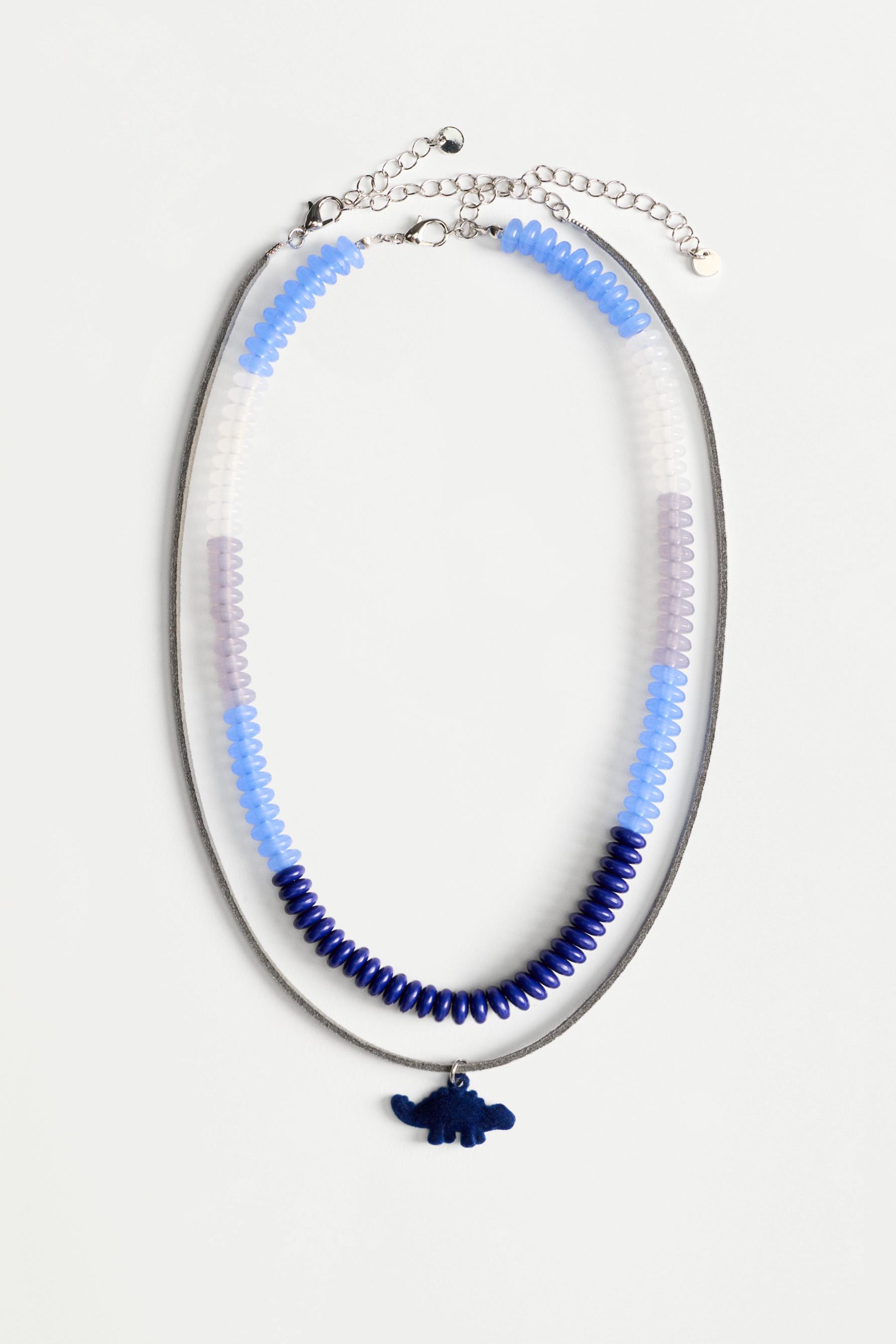 Collar doble dinosaurio