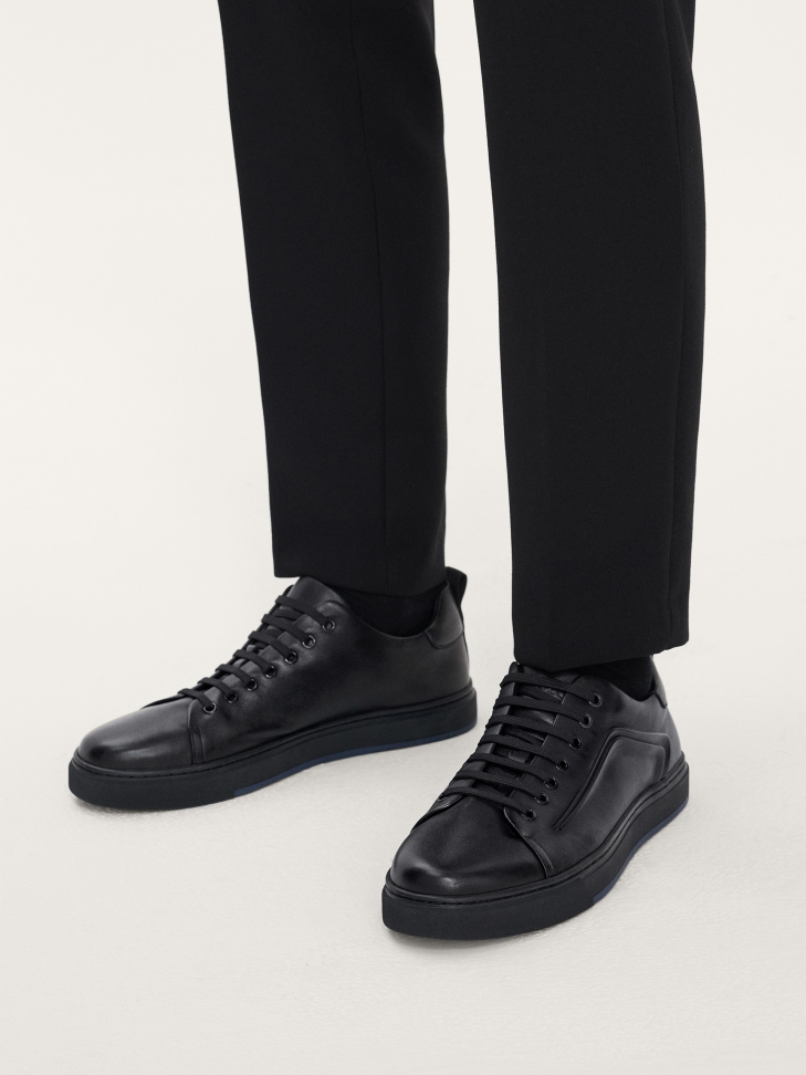 Black sneakers for men with a protruding, embossed pattern