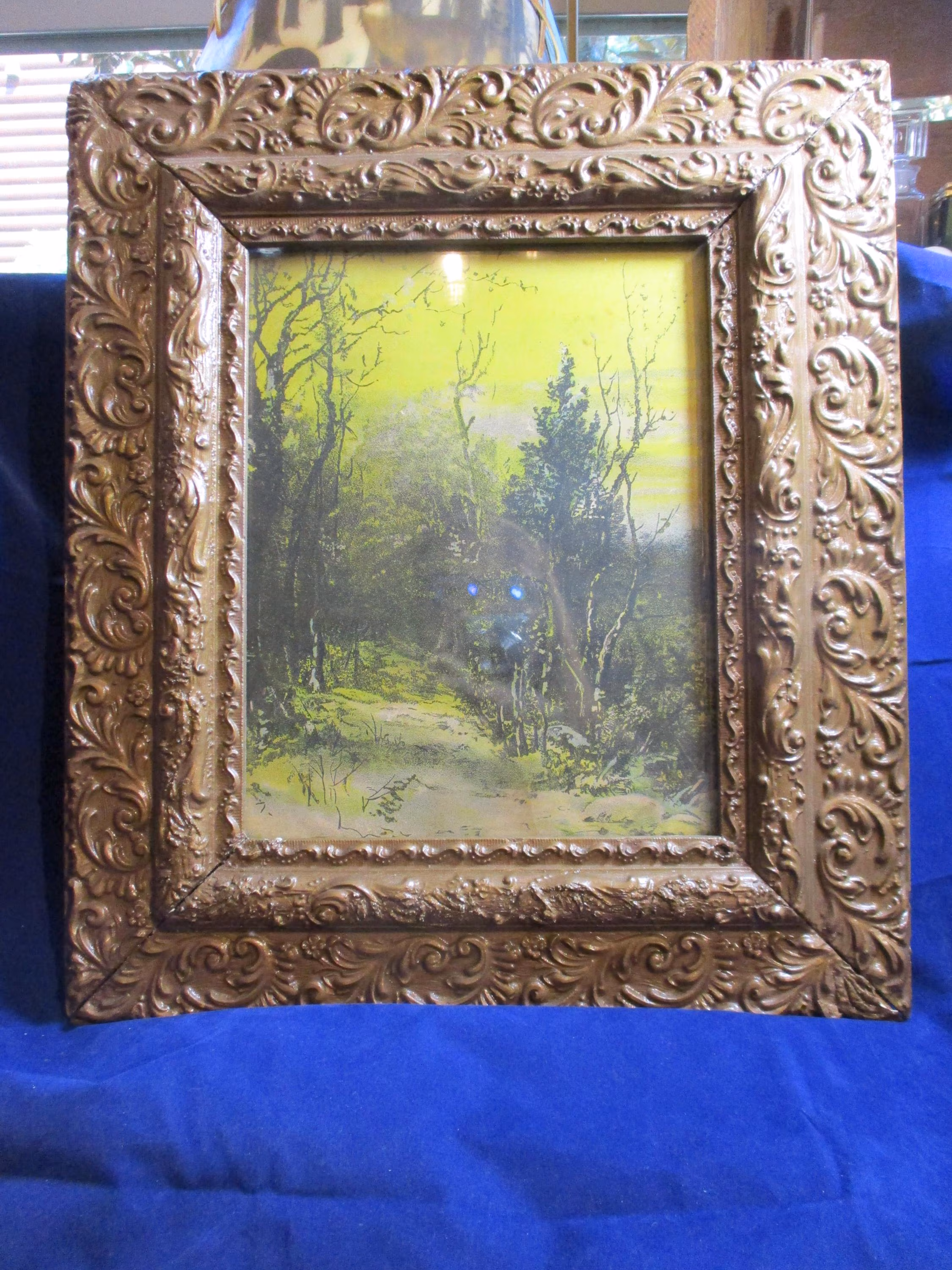 A Vintage Lithograph of a Woodland Scene...Framed in a Very Ornate Solid Wooden Frame.