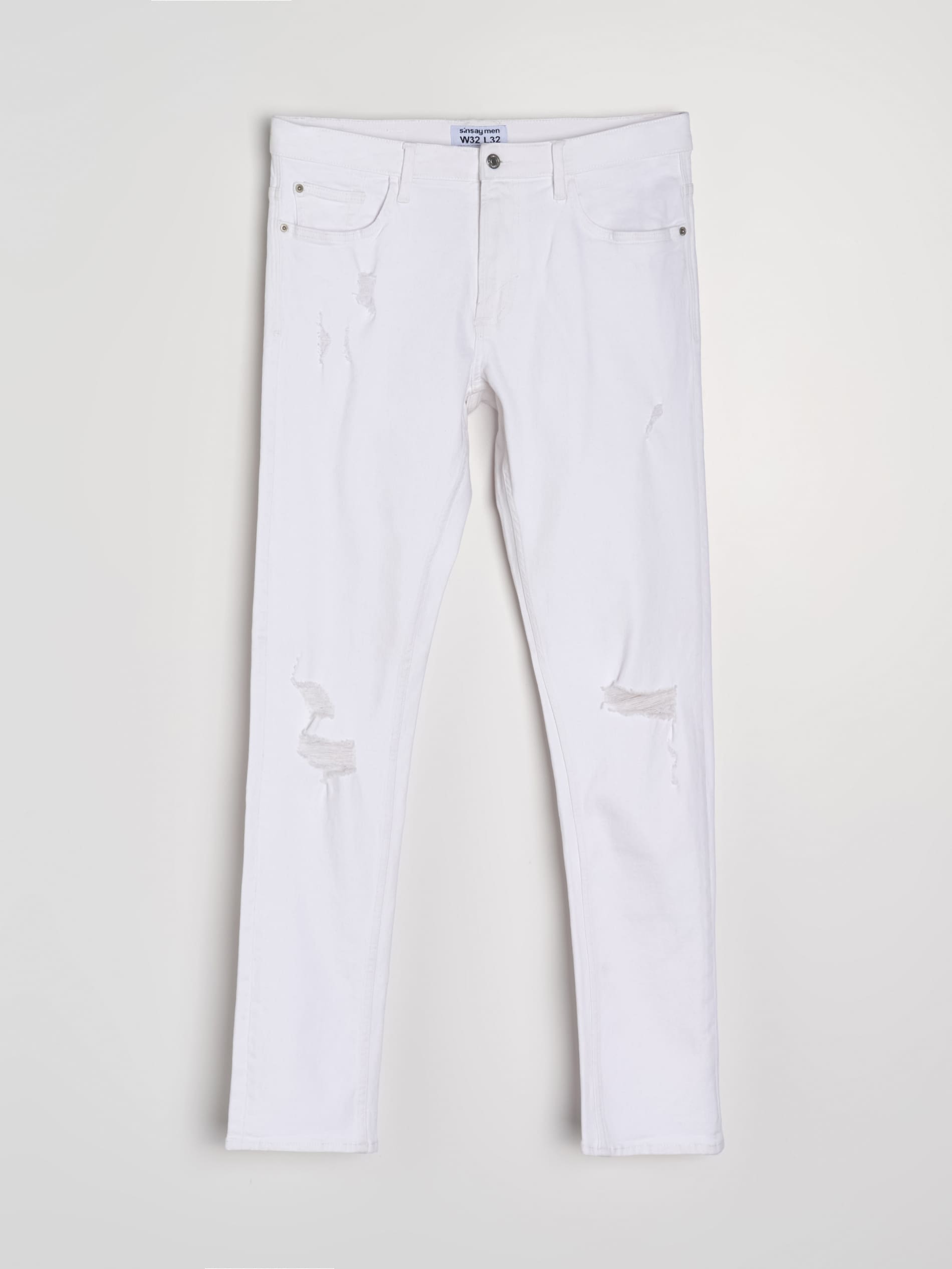 Jeansy slim fit z przetarciami