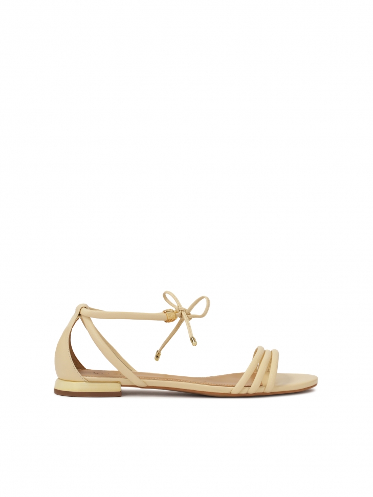 Cream sandals with binding and full heel