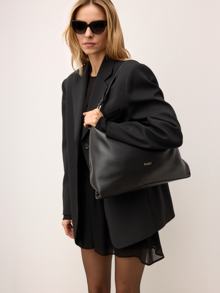 Black leather handbag with a loose fit