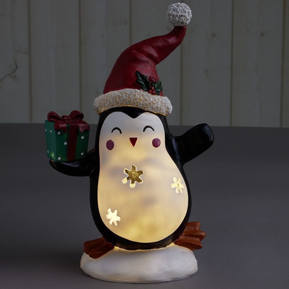 Pingouin solaire polyrésine No&euml;l 1 LED blanc chaud H30cm
