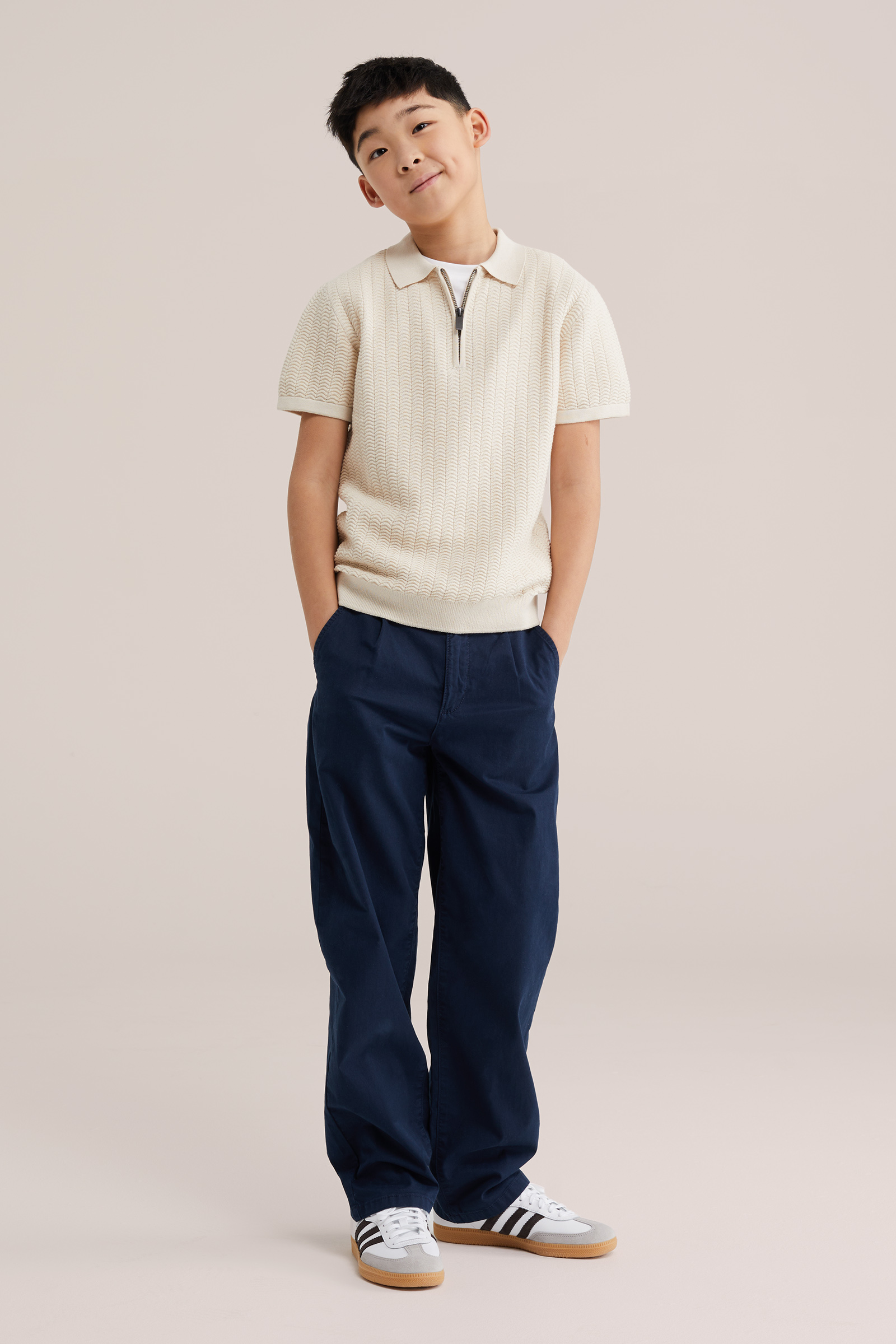 Jongens gebreide polo met quarter-zip en structuur