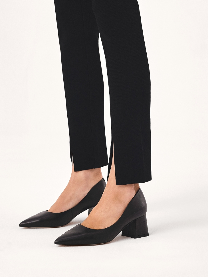 Black pumps with a low high wide heel
