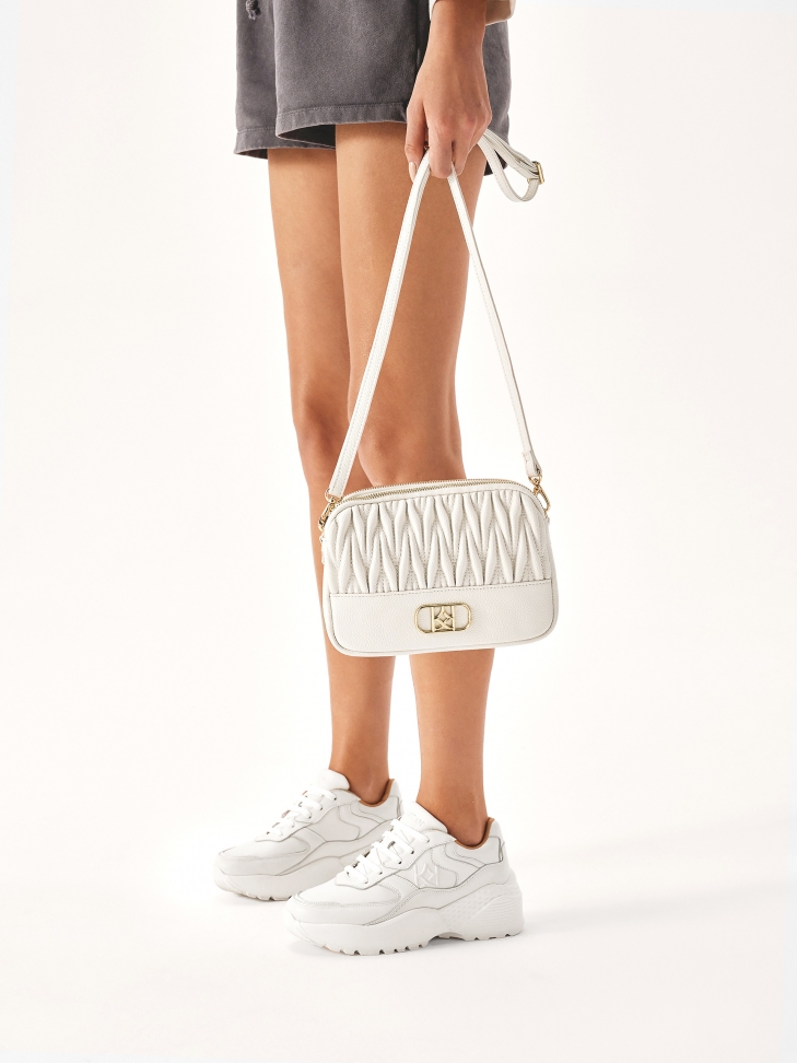 White leather sneakers on a thick sole