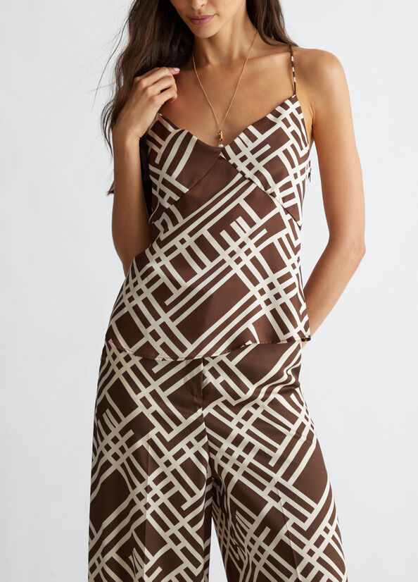 Top da completo con stampa chain