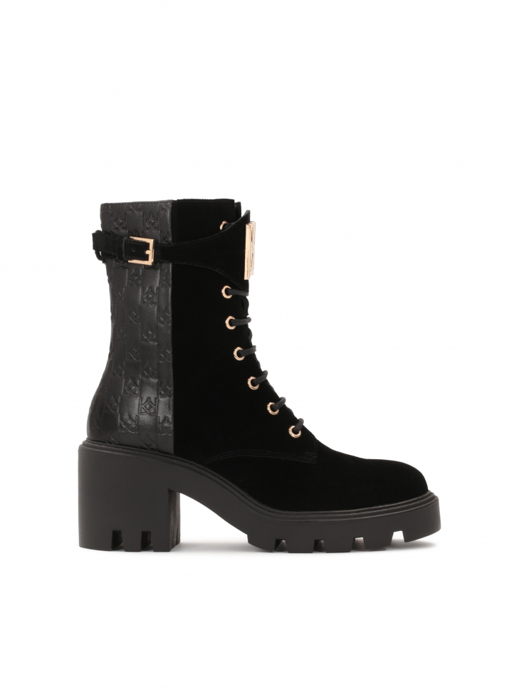 Black ladies' boots with thick heel with a lug
