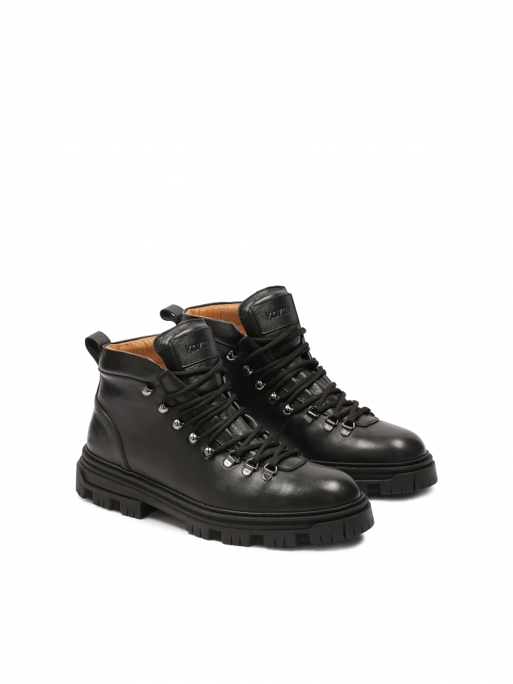 Lace-up boots on a treaded sole