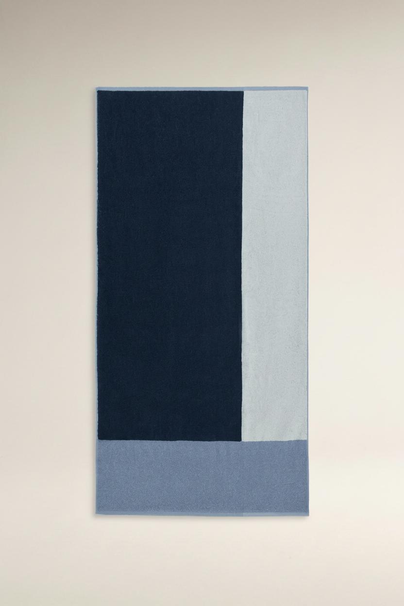 Toalla de ducha color block 140 x 70 cm