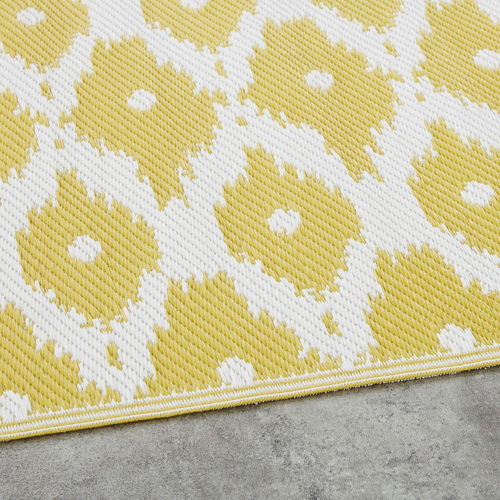 DHATU - Tapis réversible en polypropylène jaune motifs graphiques blancs 75x140