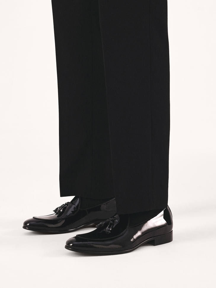Black patent loafers with tassels