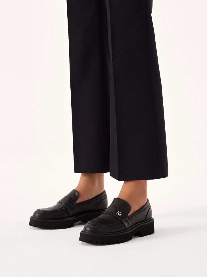 Black shoes on a treaded sole