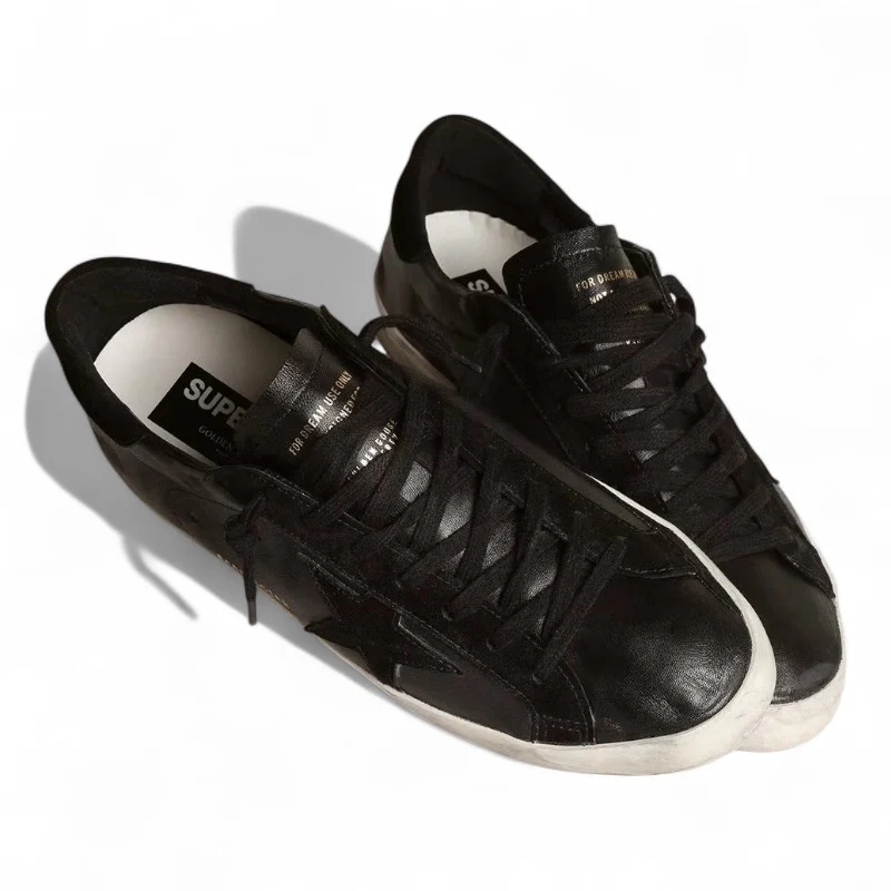 Super-Star in black nappa with black suede star and heel tab
