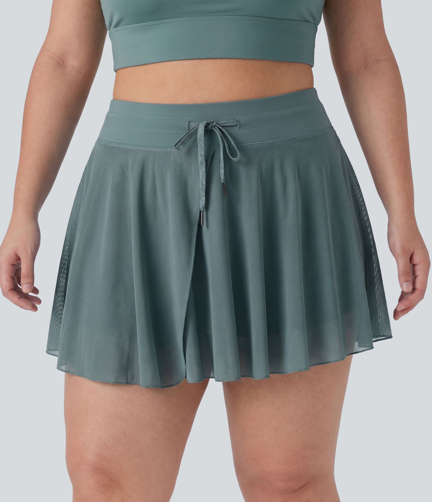Jupe-short mini grande taille fluide et flare taille haute à cordon avec mesh contrasté, poches et longueur allongée