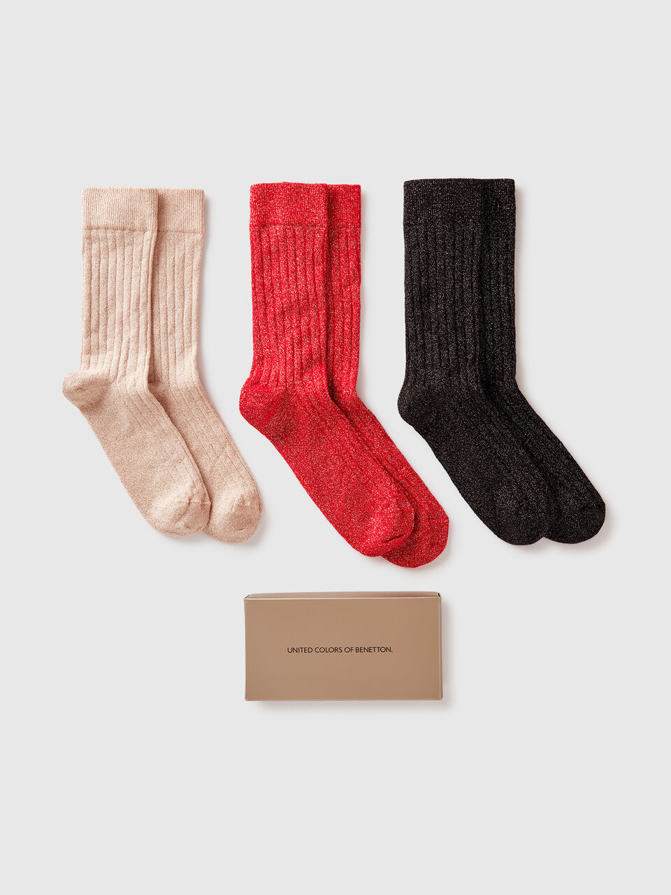Three pairs of long socks with lurex