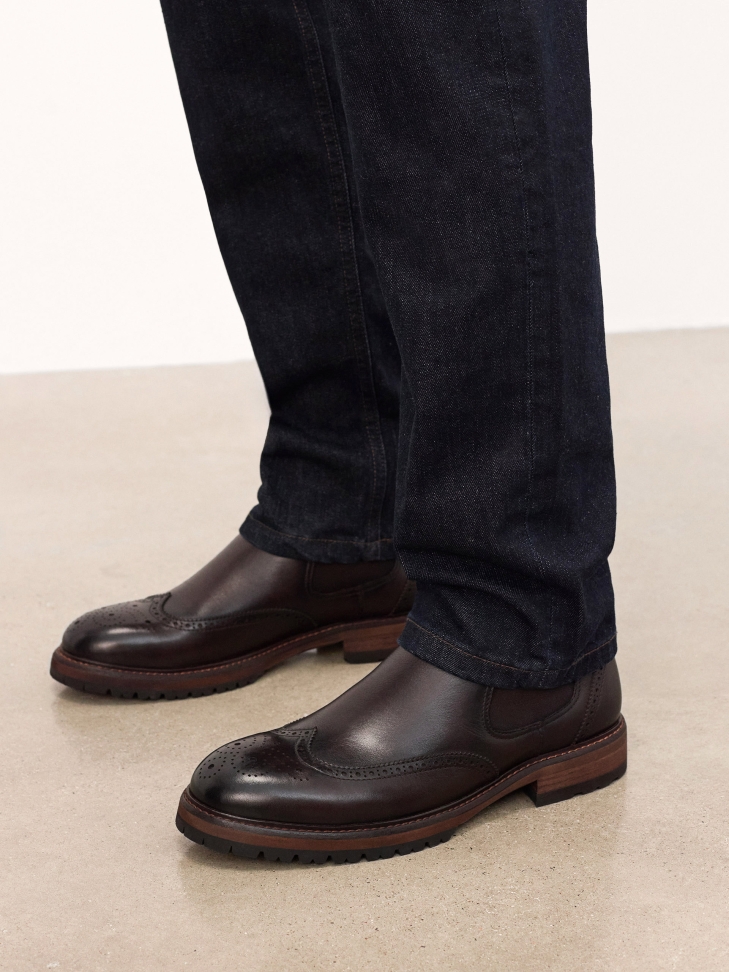 Brown leather Chelsea boots with ornamentation
