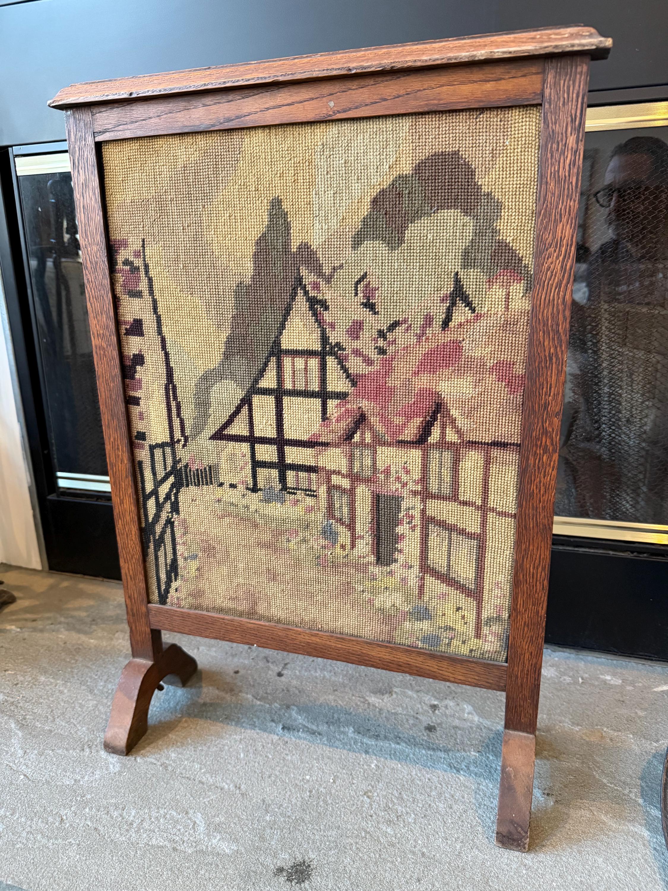 Antique Wooden Fireplace Screen with a Needlepoint Village Scene.