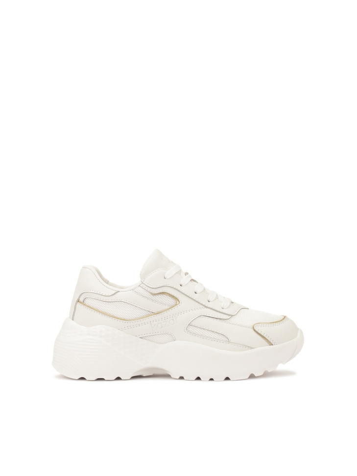 White sneakers with gold trim