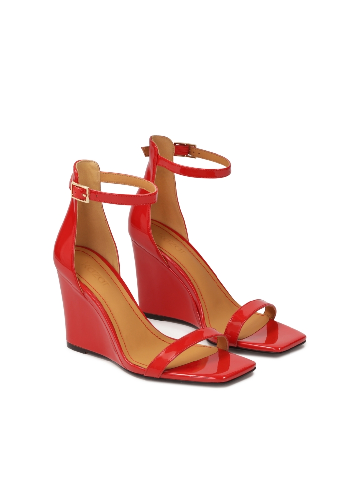 Patent leather red sandals on a platform heel