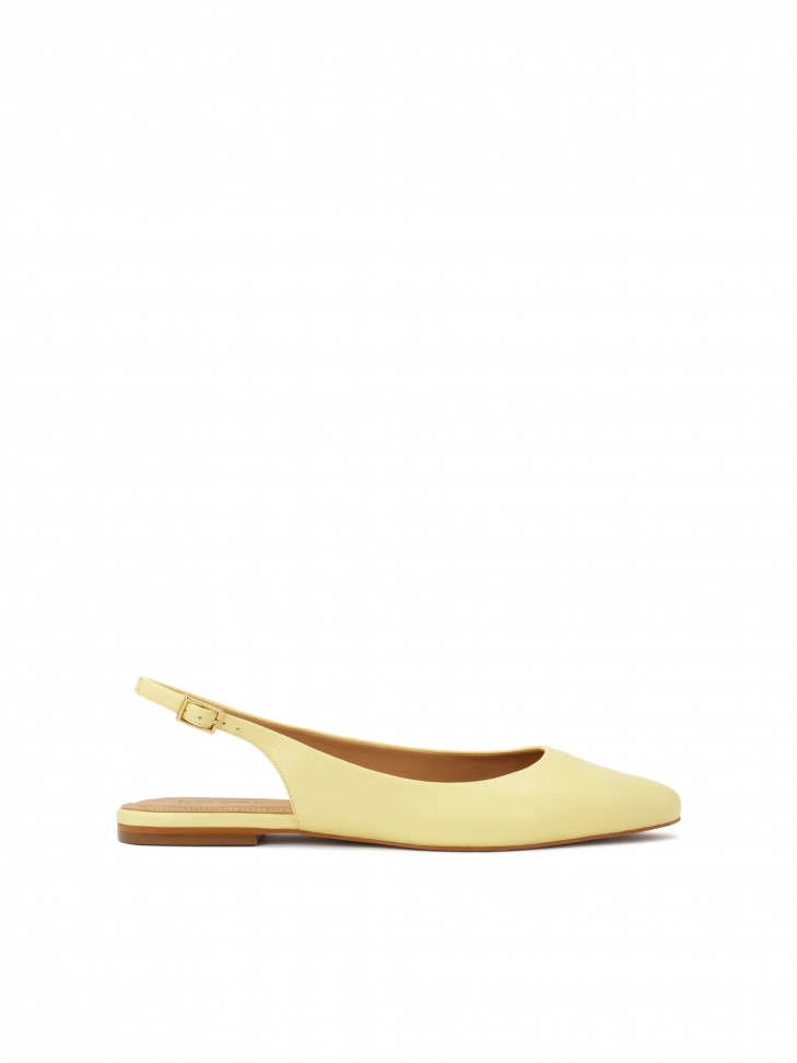 Bright yellow flat pumps with open heel