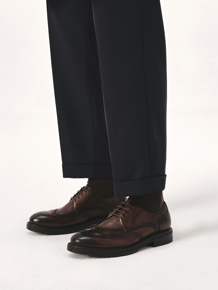 Brown shoes with brogue decoration