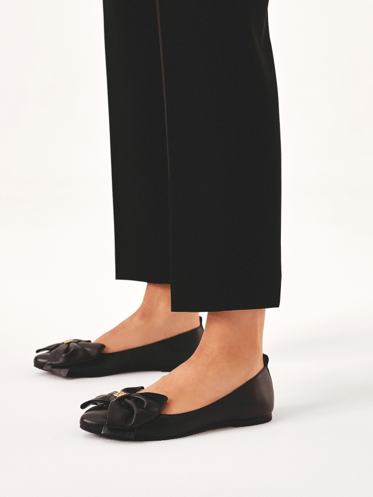 Black ballerinas with big bows