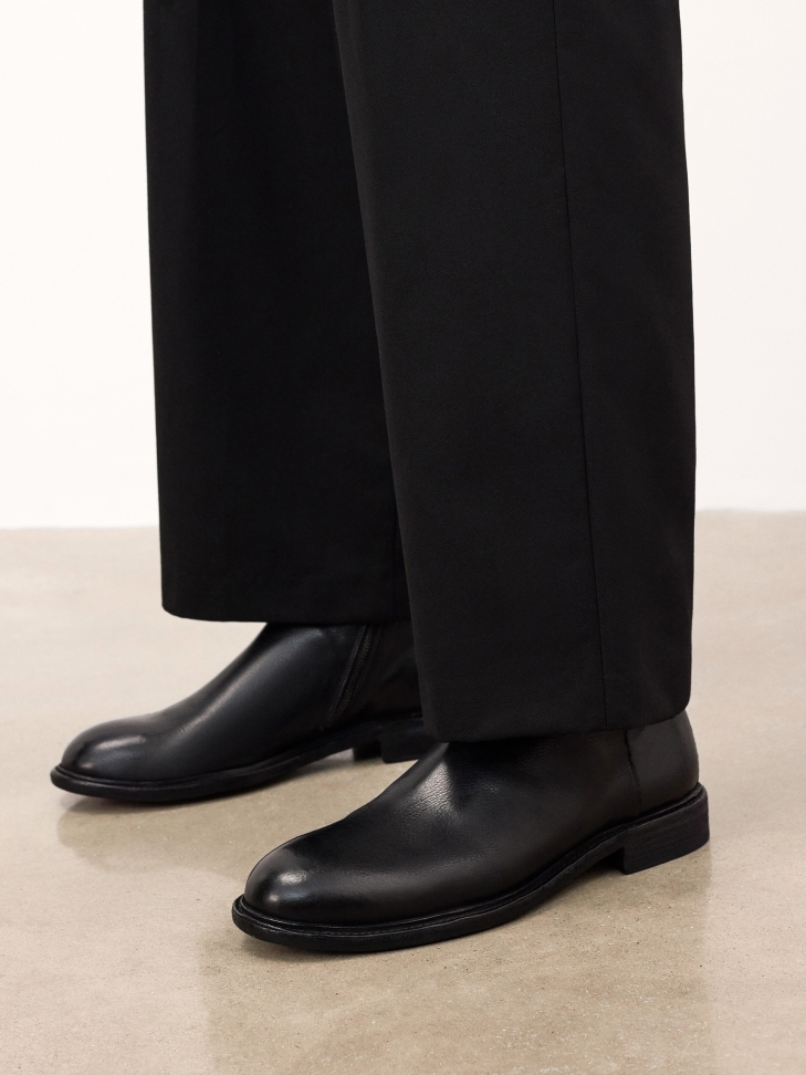 Black leather boots with zipper