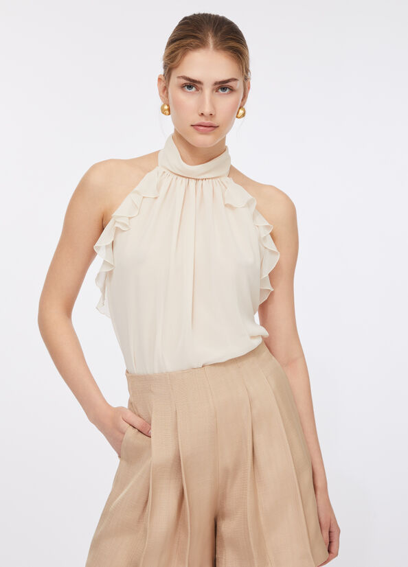 Top elegante con rouches