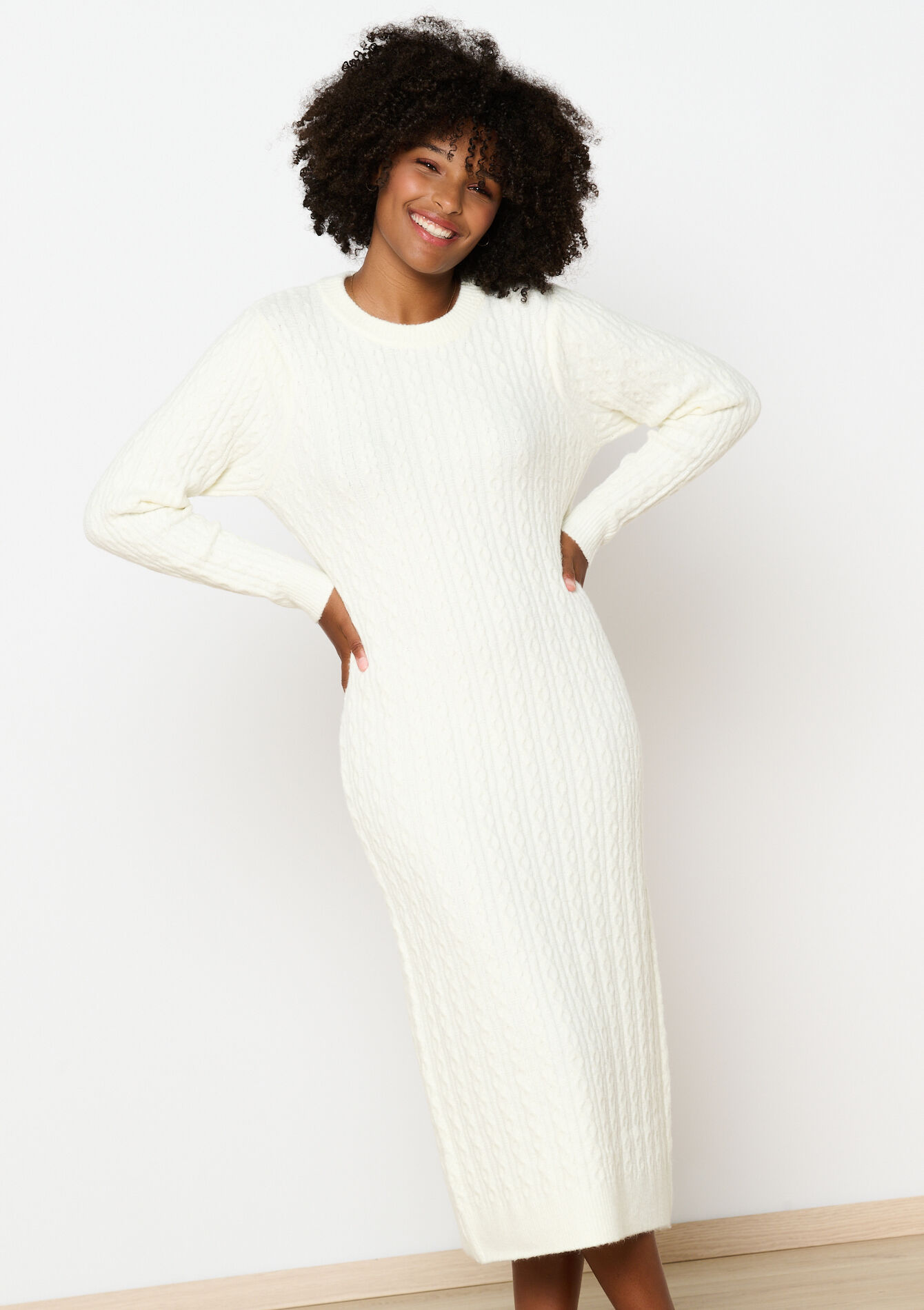 Kabelgebreide trui-jurk