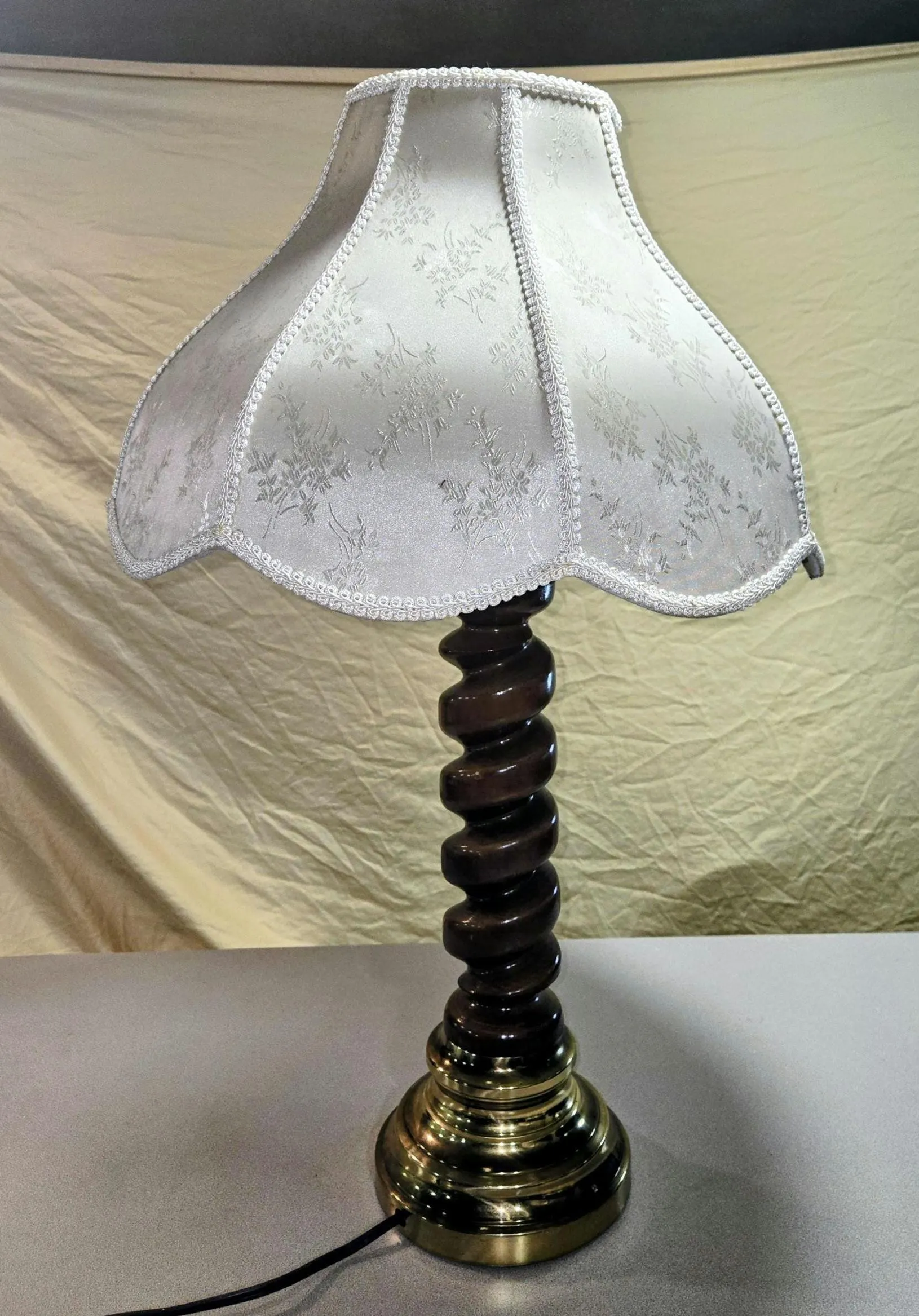 Vintage mid century carved wood spiral shaft and brass base.