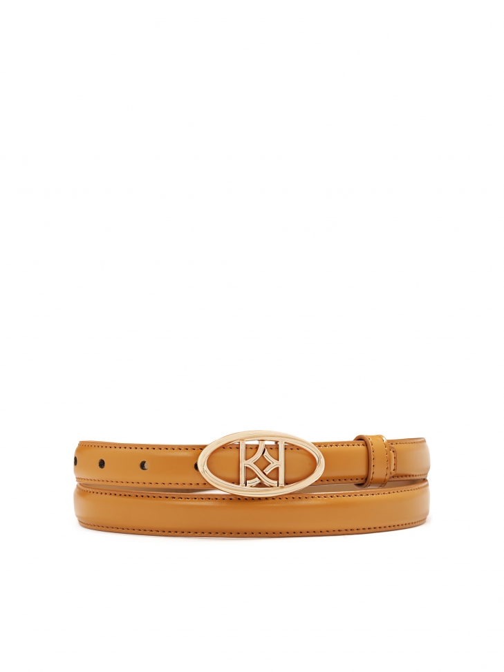 Narrow light brown belt with decorative buckle