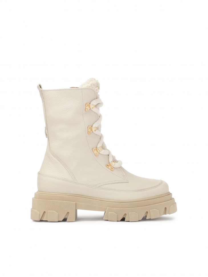 Beige boots with high laced upper