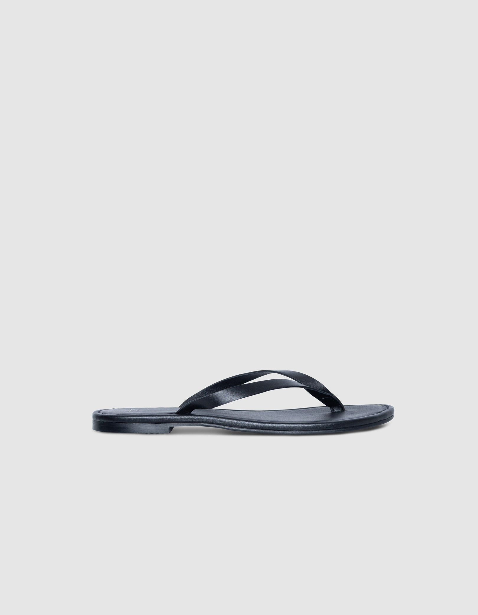 Tongs noires plates cuir Femme