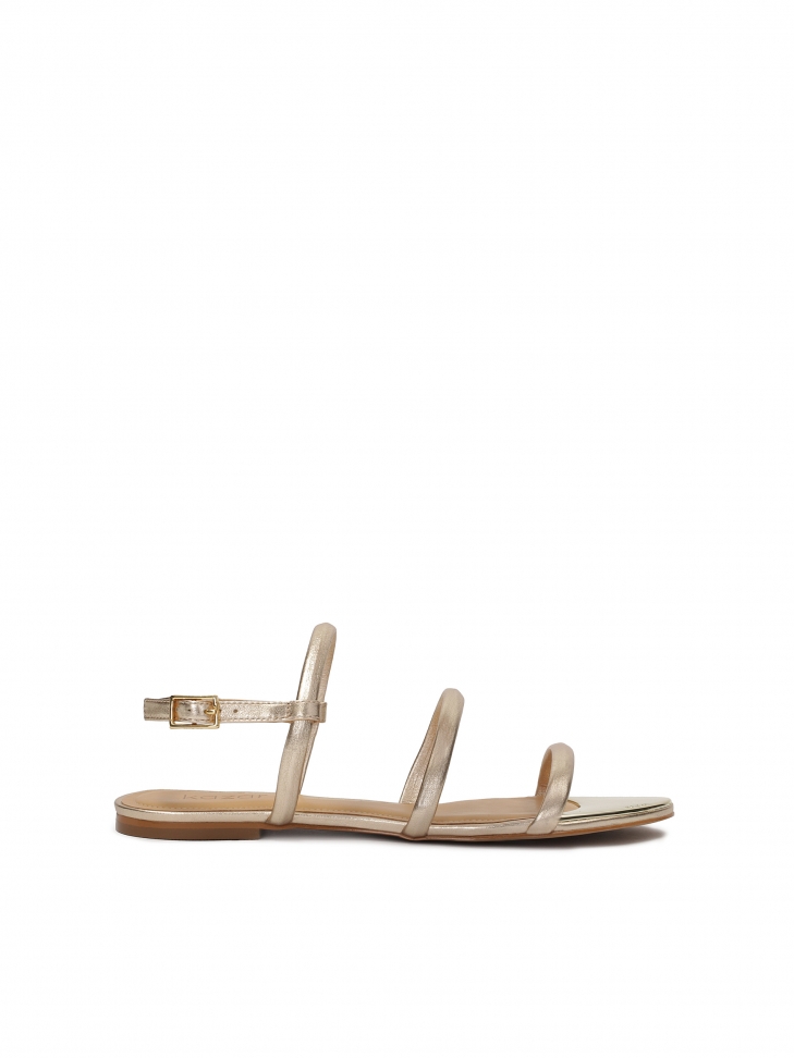 Flat gold sandals with three straps