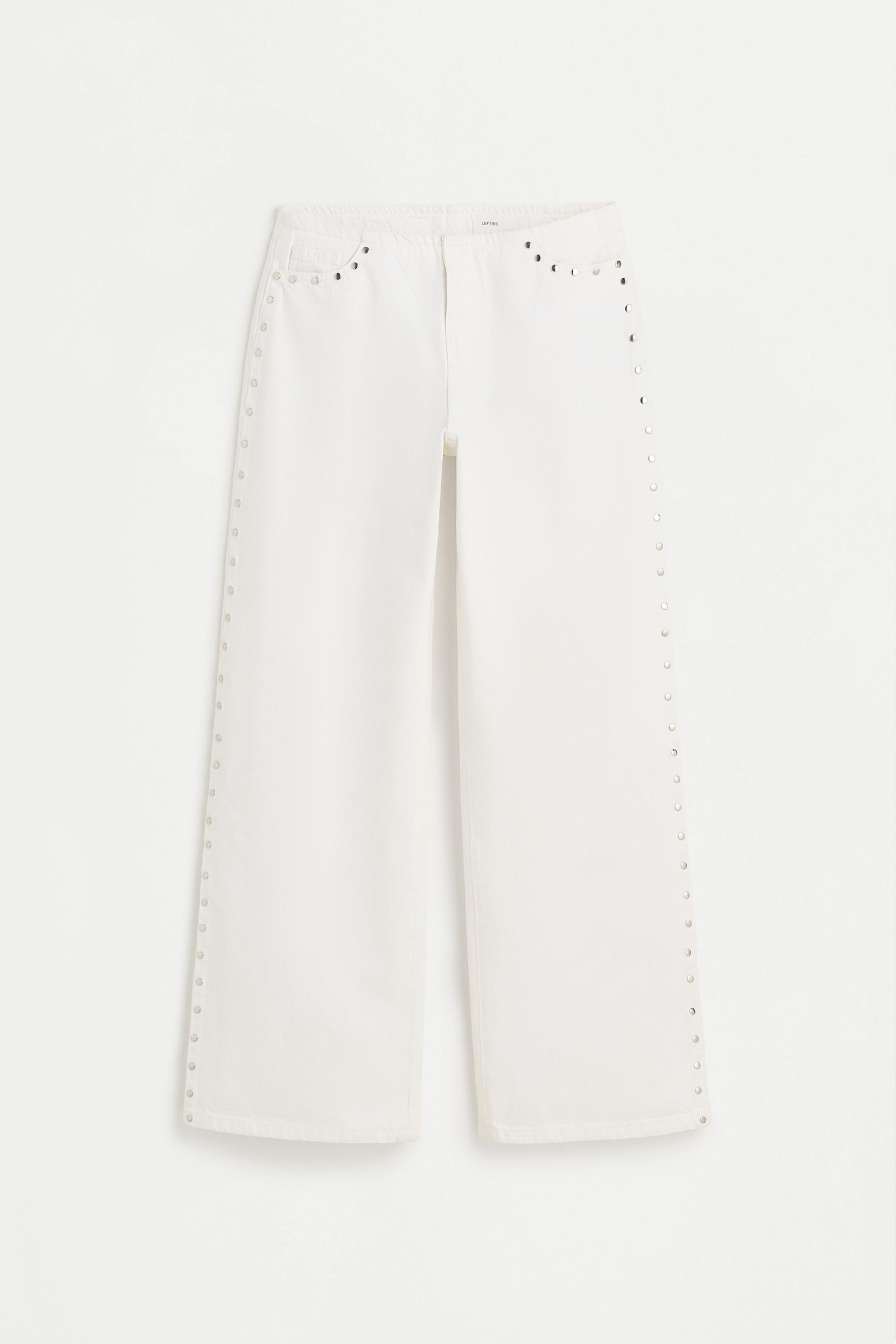 Jeans wide leg sin cintura tachas
