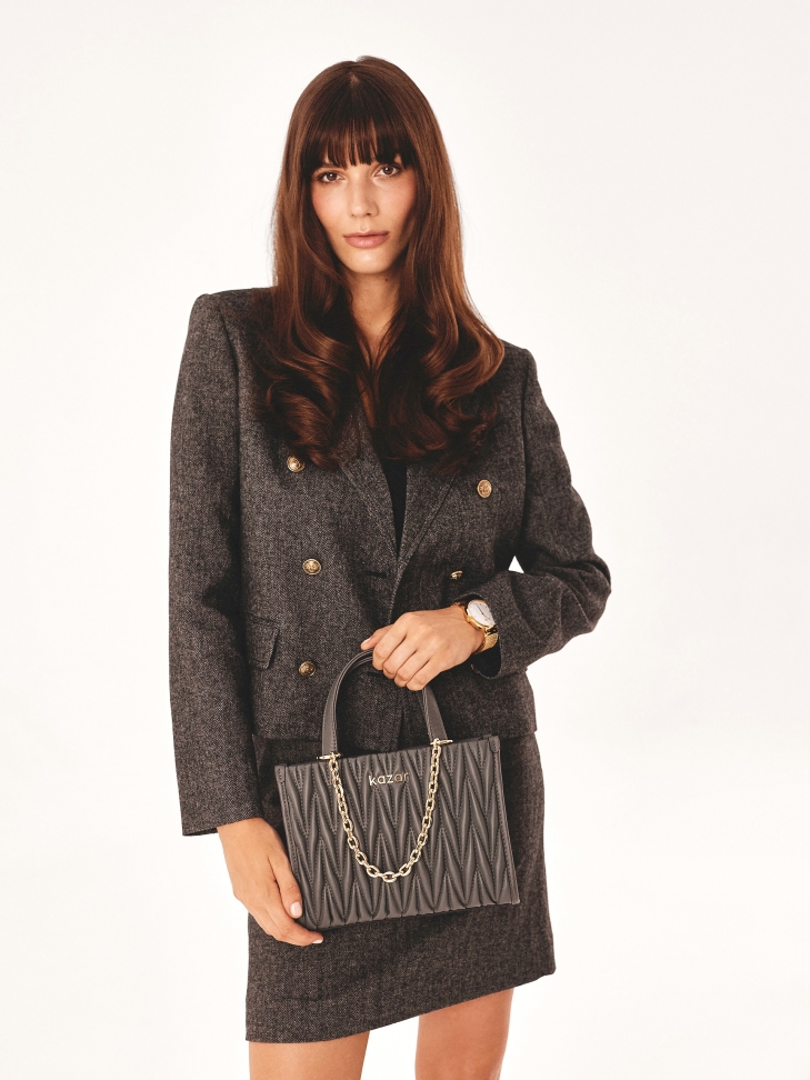 Grey handbag with quilted front and chain