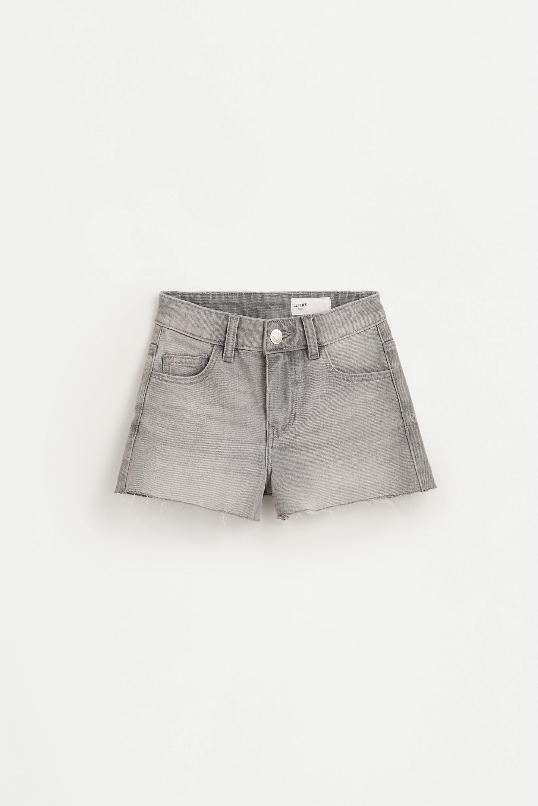 Short denim tachas