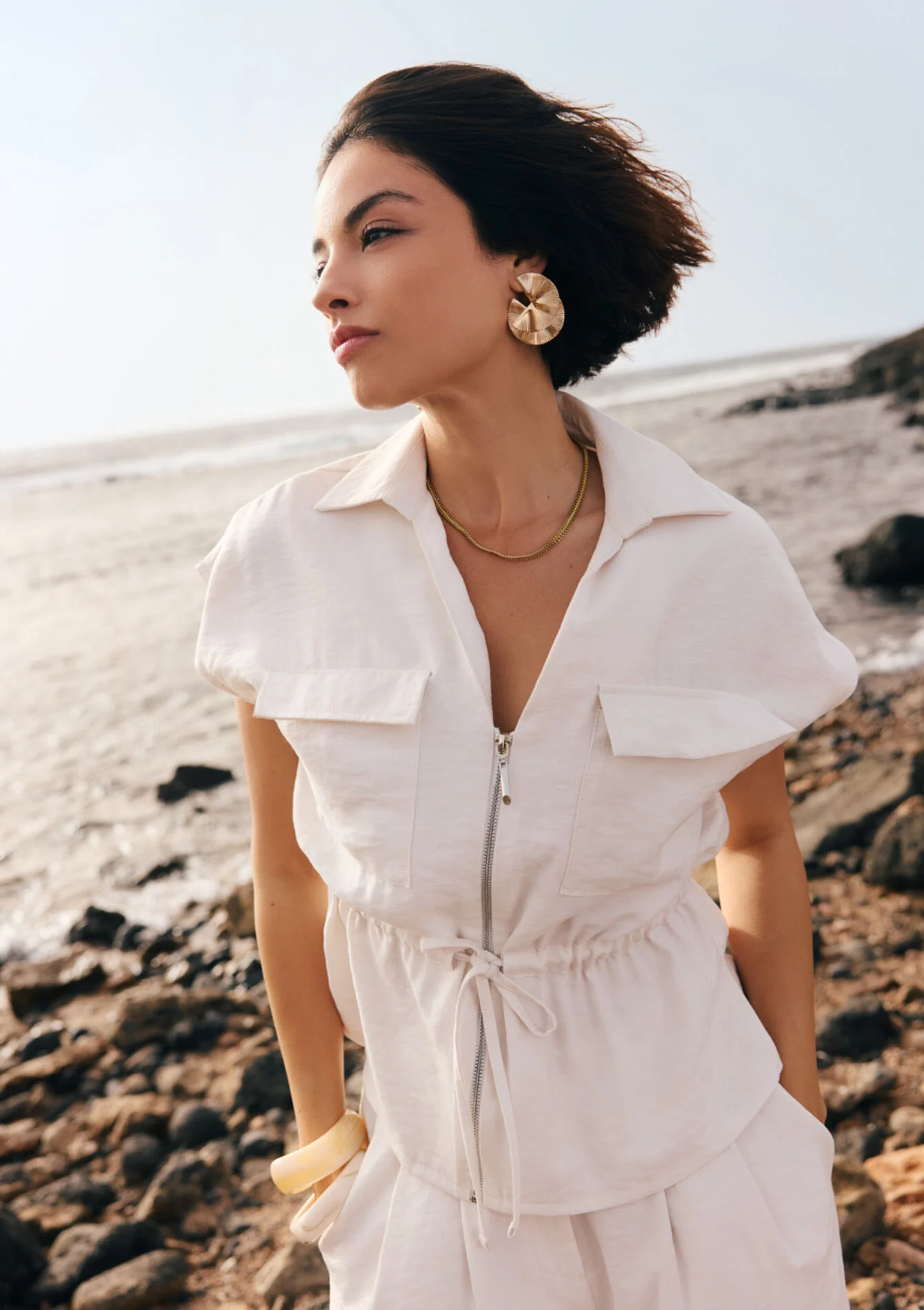 Mouwloze jas met rits