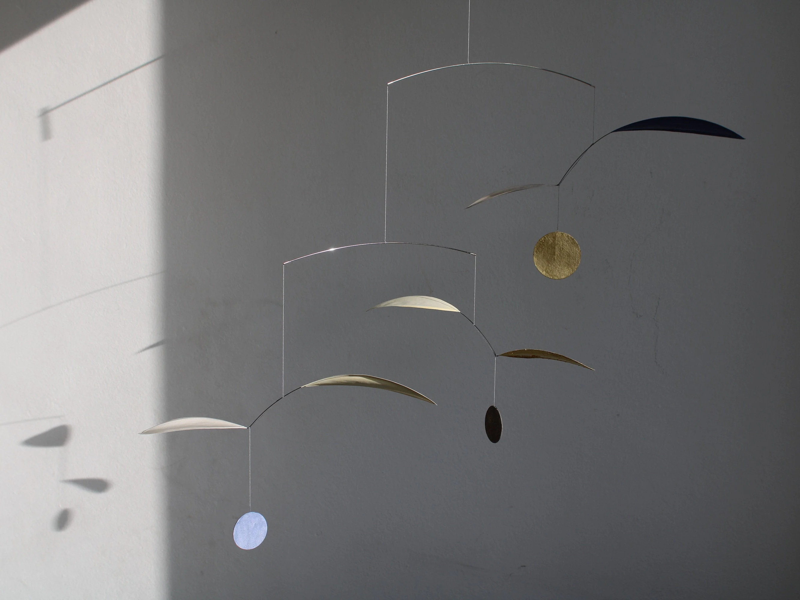 Lightweight mobile handmanufactured from paper and stainless steel wire