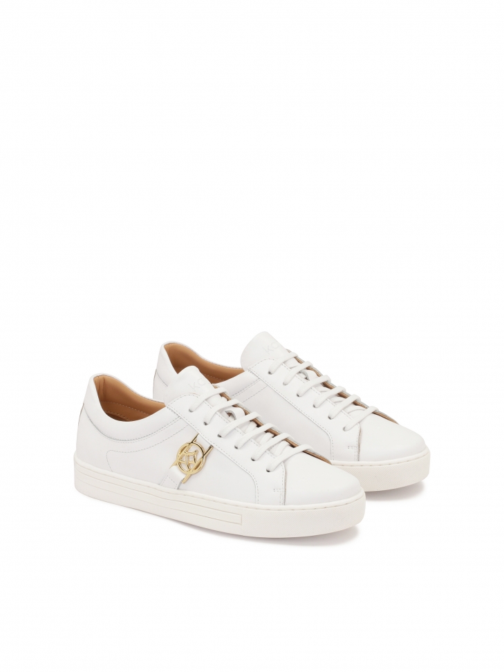 White leather sneakers with golden elements