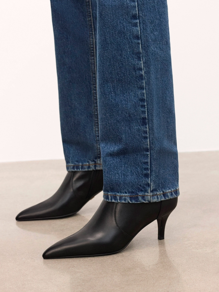 Minimalist black leather boots