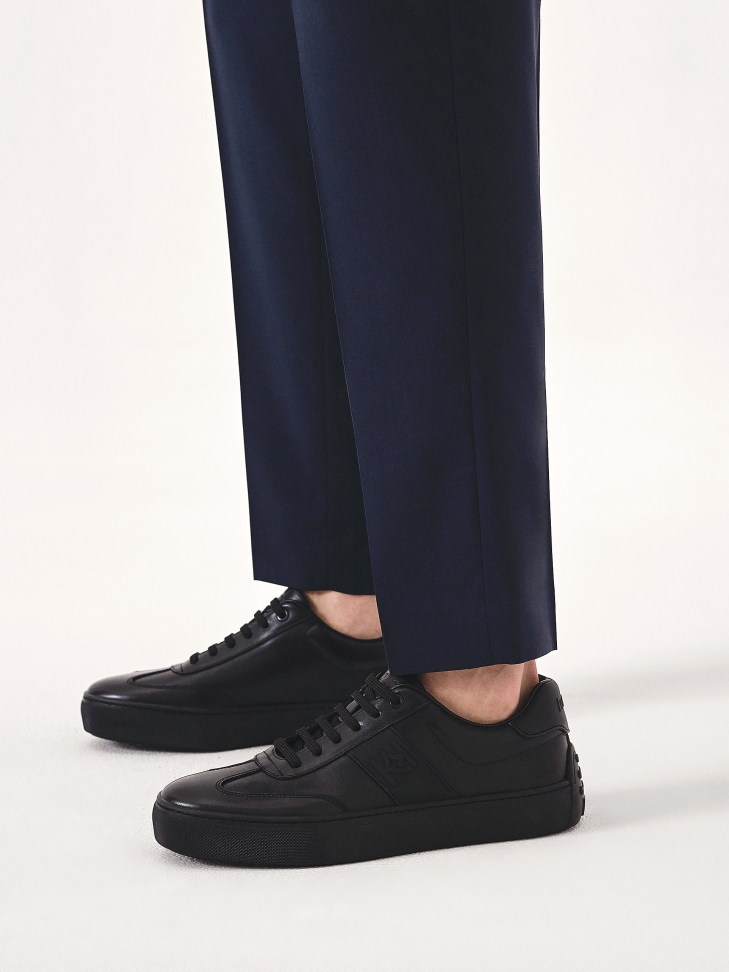 Black leather sneakers with rubber on the heel