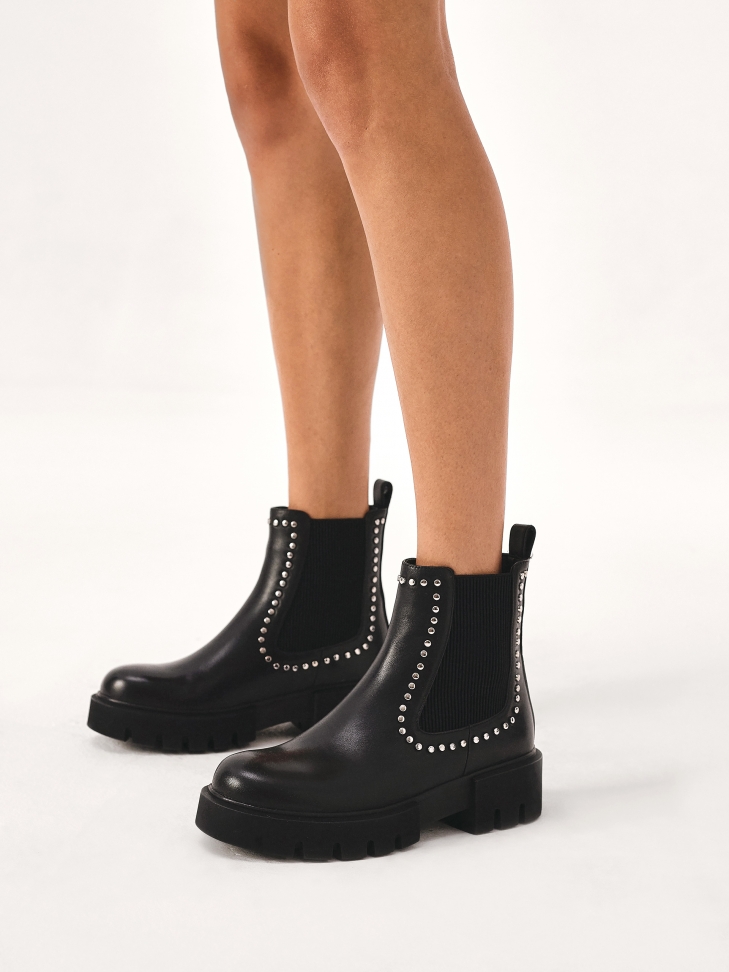 Riveted Chelsea boots on a thick sole