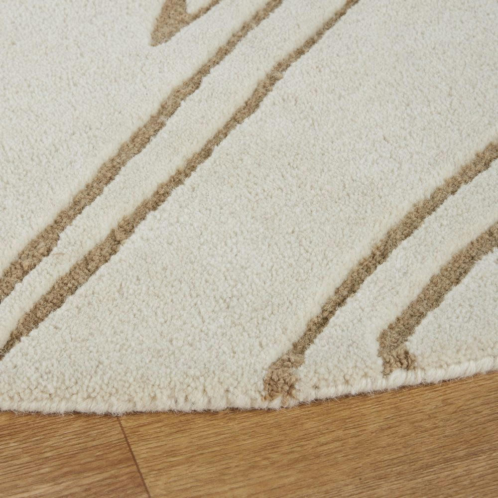 BOUSSENS - Tapis rond en laine tuftée et ciselée écrue motifs vagues beiges D180