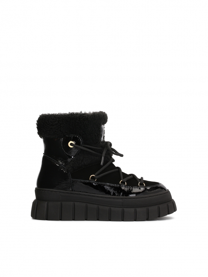 Insulated black snow boots made of combined materials